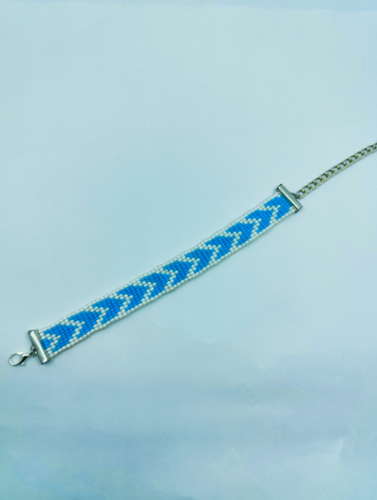Handcrafted blue and white geometric seed bead loom bracelet with silver adjustable chain