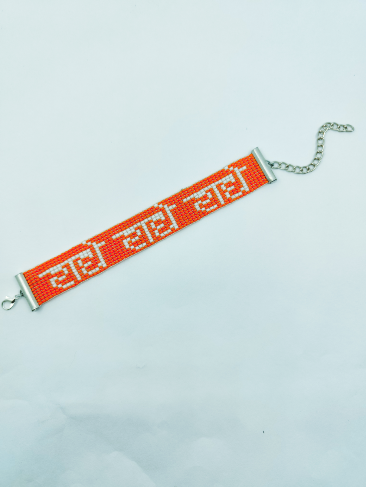 Hand-Woven "Radhe Radhe" Beaded Bracelet in Saffron & White
