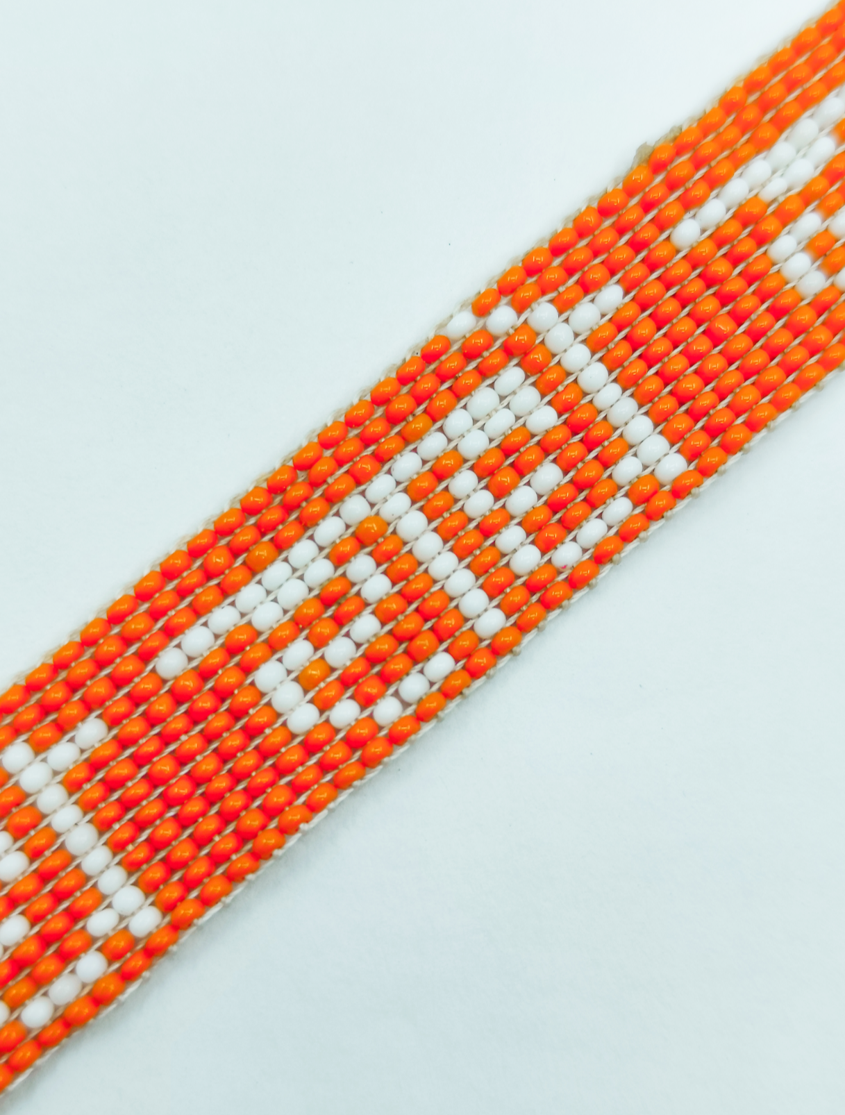 Hand-Woven "Radhe Radhe" Beaded Bracelet in Saffron & White